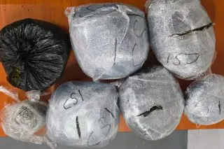 Police find gun, ammo, ganja at Shoe Lane
