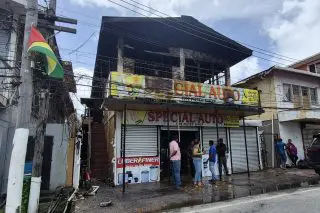 Fire damages auto store, living quarters on South Road