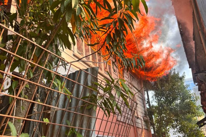 Fire spreads to four buildings at Cummings Street and North Road