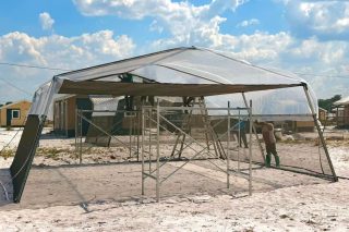 Benn visits Hyde Park project as shade houses target income for single mothers